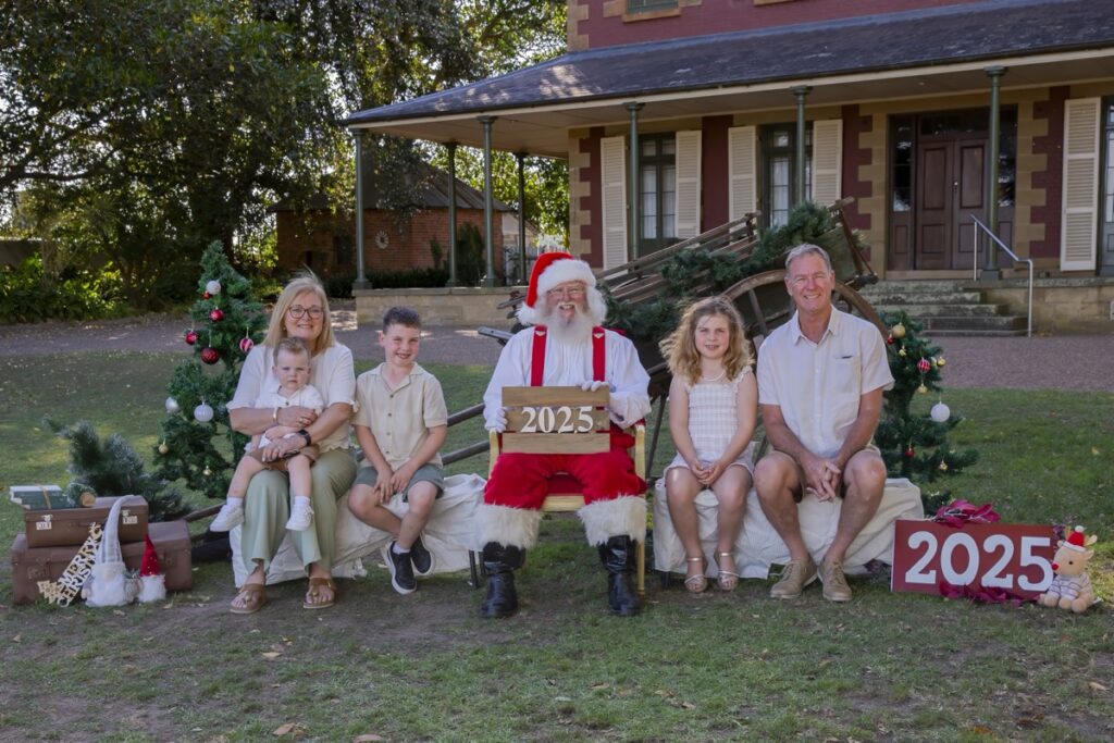 Family having Christmas photos taken with Santa at Tocal Homestead in the Hunter Valley